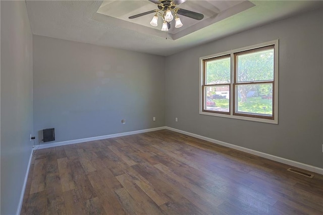 211 Carla St, Excelsior Springs, MO 64024 - empty room with dark wood finished floors, baseboards, and ceiling fan