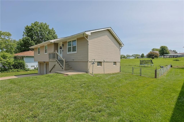 211 Carla St, Excelsior Springs, MO 64024 - view of front of property featuring an attached garage, stairs, and asphalt driveway