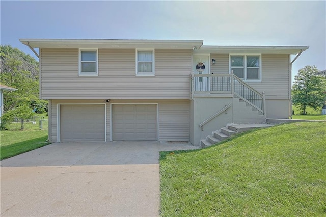 211 Carla St, Excelsior Springs, MO 64024 - view of front of house with a garage, a front yard, and driveway