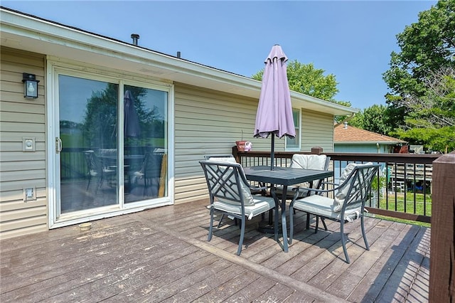 211 Carla St, Excelsior Springs, MO 64024 - wooden deck with outdoor dining area