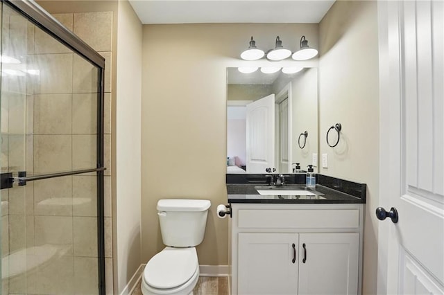 3716 NW 76th St, Kansas City, MO 64151 - bathroom with toilet, a shower stall, and vanity