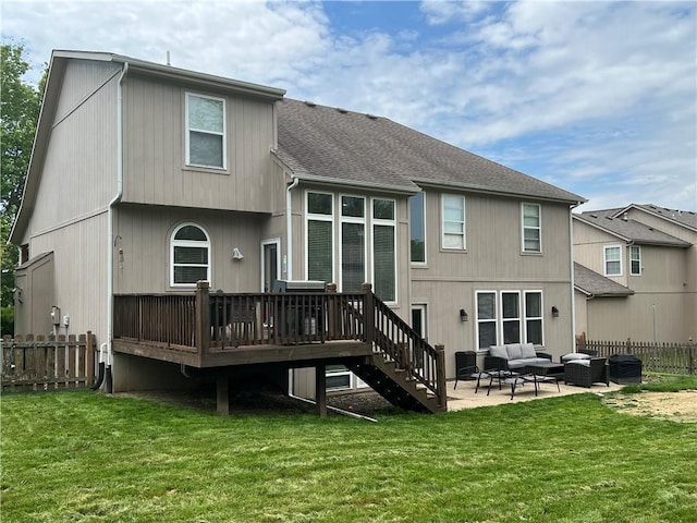 1530 Horseshoe Dr, Raymore, MO 64083 - back of house with outdoor lounge area, a deck, a patio area, roof with shingles, and stairs