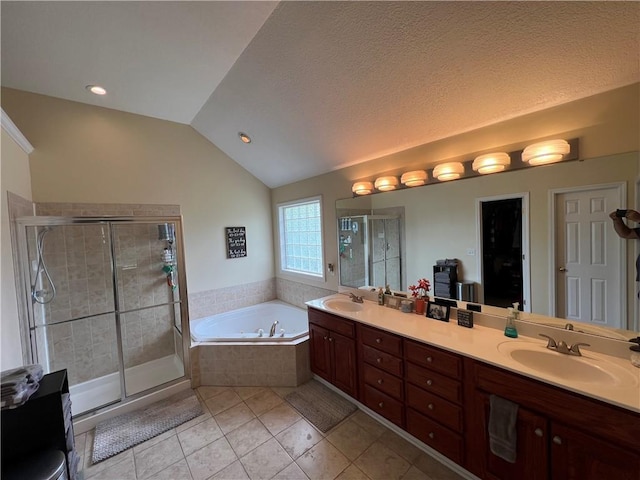 1530 Horseshoe Dr, Raymore, MO 64083 - full bathroom with tile patterned floors, a shower stall, a bath, lofted ceiling, and double vanity