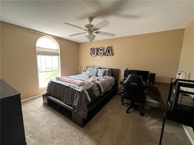 1530 Horseshoe Dr, Raymore, MO 64083 - carpeted bedroom featuring a textured ceiling, a ceiling fan, baseboards, and an office area