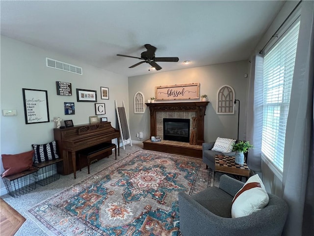 1530 Horseshoe Dr, Raymore, MO 64083 - living room featuring plenty of natural light, ceiling fan, baseboards, and carpet floors
