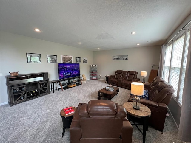 1530 Horseshoe Dr, Raymore, MO 64083 - living area featuring carpet floors, recessed lighting, a textured ceiling, and baseboards