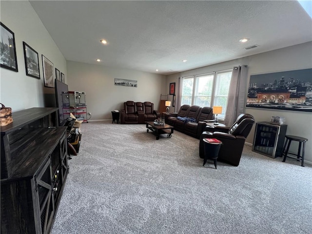 1530 Horseshoe Dr, Raymore, MO 64083 - living area with carpet flooring, recessed lighting, baseboards, and a textured ceiling