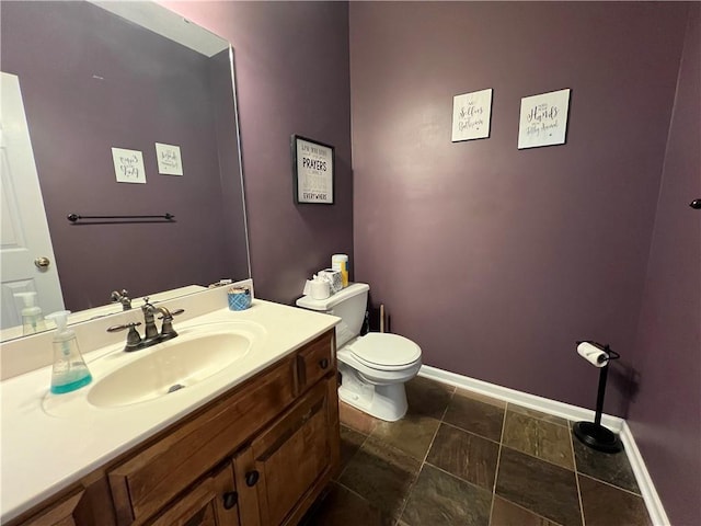 1530 Horseshoe Dr, Raymore, MO 64083 - half bath with toilet, vanity, and baseboards