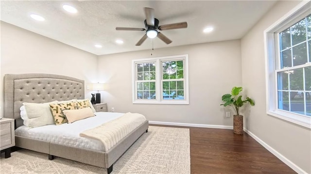 bedroom with wood finished floors, baseboards, recessed lighting, and ceiling fan