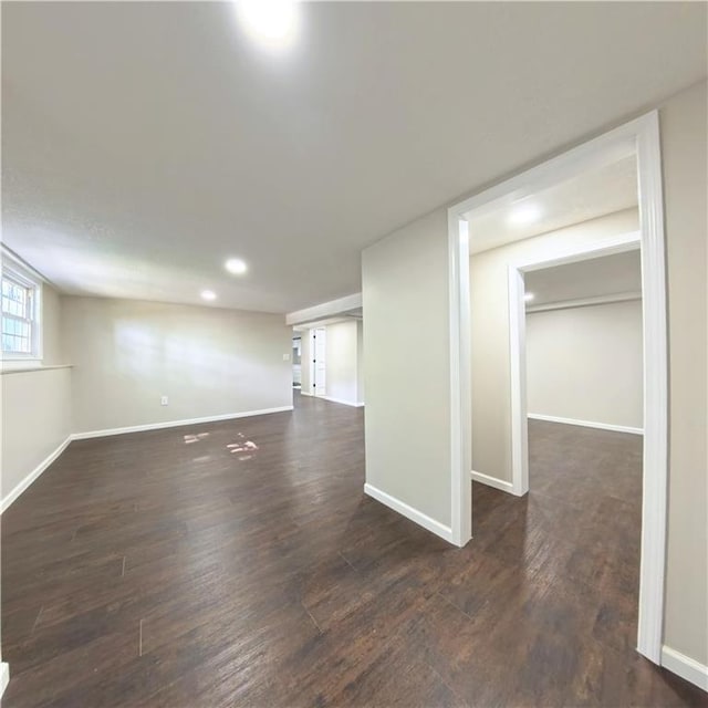 basement featuring wood finished floors, baseboards, and recessed lighting