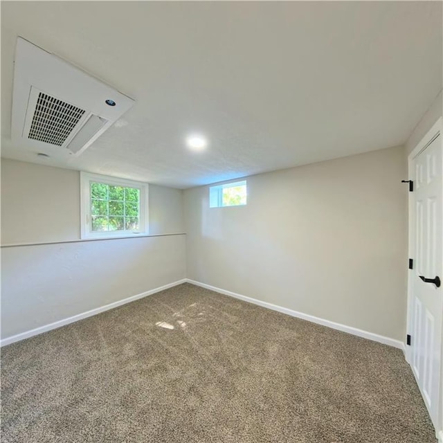 basement featuring carpet floors, baseboards, and recessed lighting