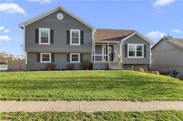 957 NW Dogwood Dr, Grain Valley, MO 64029 - split level home featuring covered porch