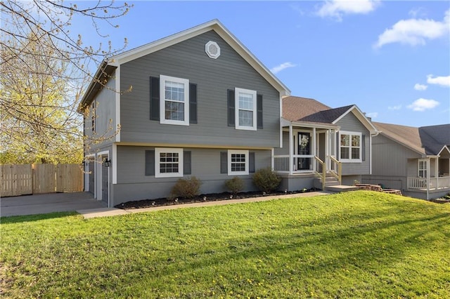 957 NW Dogwood Dr, Grain Valley, MO 64029 - split level home with an attached garage