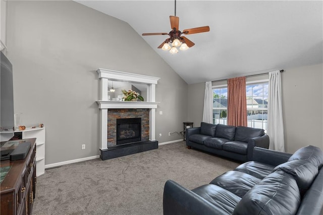 957 NW Dogwood Dr, Grain Valley, MO 64029 - living room featuring a stone fireplace, a ceiling fan, high vaulted ceiling, carpet, and baseboards