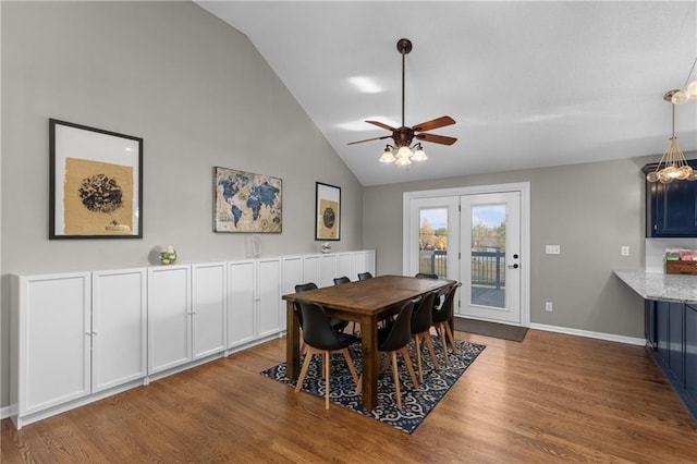 957 NW Dogwood Dr, Grain Valley, MO 64029 - dining room featuring a ceiling fan, wood finished floors, baseboards, and high vaulted ceiling