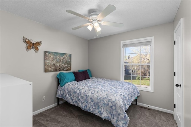 957 NW Dogwood Dr, Grain Valley, MO 64029 - bedroom with carpet, baseboards, a textured ceiling, and ceiling fan