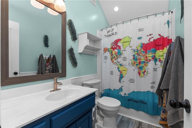 957 NW Dogwood Dr, Grain Valley, MO 64029 - bathroom with vanity, toilet, wood finished floors, and shower / tub combo with curtain