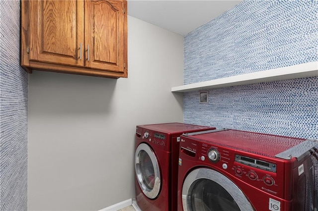 957 NW Dogwood Dr, Grain Valley, MO 64029 - laundry area featuring cabinet space, washer and dryer, and baseboards