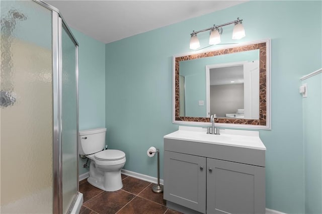 957 NW Dogwood Dr, Grain Valley, MO 64029 - full bath featuring toilet, a shower stall, vanity, and tile patterned flooring