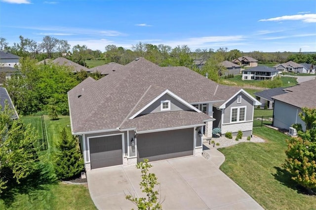 22622 W 87th Ter, Lenexa, KS 66227 - view of front of property with an attached garage, driveway, a front yard, a shingled roof, and a residential view