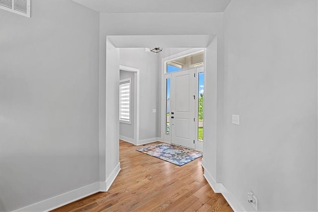 22622 W 87th Ter, Lenexa, KS 66227 - foyer entrance with baseboards, light wood-type flooring, and plenty of natural light