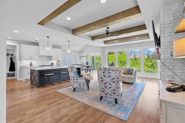 22622 W 87th Ter, Lenexa, KS 66227 - living room featuring light wood-style flooring, recessed lighting, beam ceiling, and ceiling fan