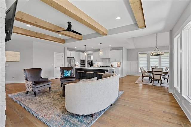 22622 W 87th Ter, Lenexa, KS 66227 - living area with ceiling fan, light wood-style floors, beamed ceiling, recessed lighting, and a chandelier