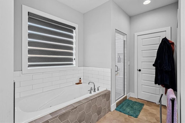 22622 W 87th Ter, Lenexa, KS 66227 - bathroom featuring a shower stall and a tub with jets