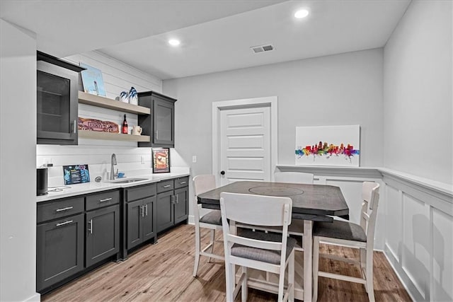 22622 W 87th Ter, Lenexa, KS 66227 - kitchen with a sink, light wood-style flooring, open shelves, light countertops, and recessed lighting