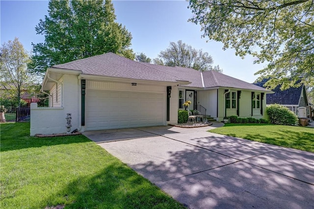 ranch-style home with concrete driveway, fence, a garage, and a front lawn