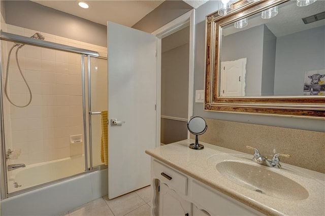 bathroom with visible vents, tile patterned flooring, bath / shower combo with glass door, vanity, and recessed lighting