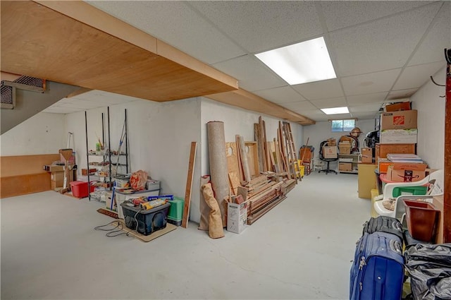 basement featuring a paneled ceiling