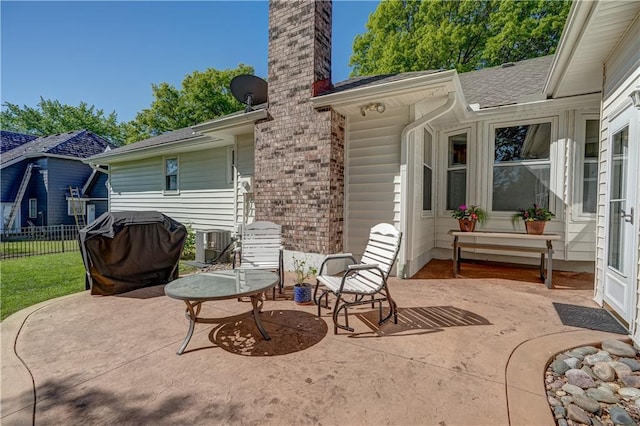 view of patio / terrace featuring cooling unit and fence
