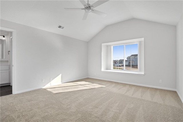 25256 W 149th Ter, Olathe, KS 66061 - interior space with carpet, connected bathroom, visible vents, baseboards, and vaulted ceiling