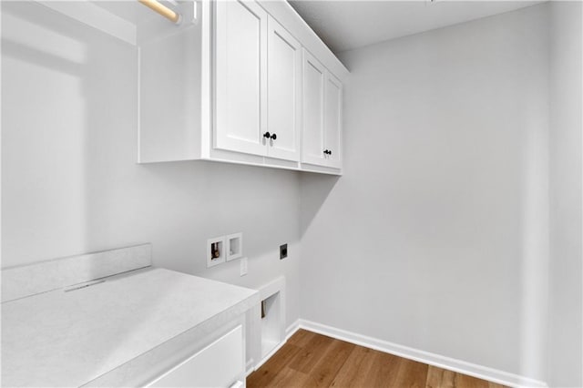 25256 W 149th Ter, Olathe, KS 66061 - clothes washing area featuring cabinet space, hookup for an electric dryer, hookup for a washing machine, dark wood-type flooring, and baseboards