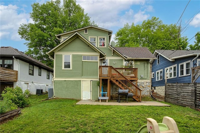 rear view of property with stairway, a wooden deck, a yard, and cooling unit