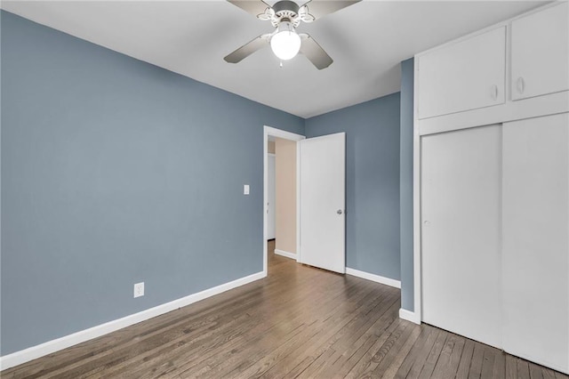 1400 NE 67th Ter, Gladstone, MO 64118 - unfurnished bedroom featuring wood finished floors, baseboards, a closet, and ceiling fan