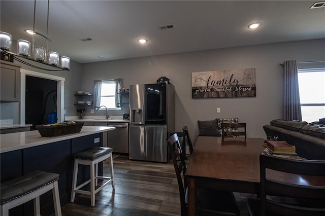 dining room featuring recessed lighting, visible vents, and dark wood-style floors
