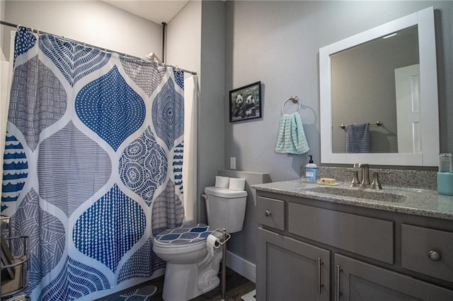 bathroom with vanity, toilet, and a shower with shower curtain