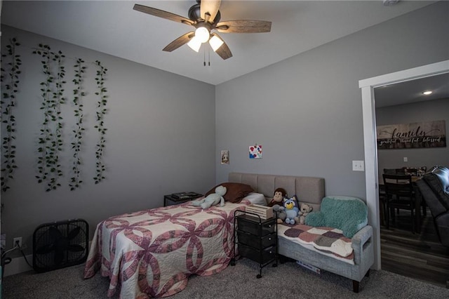 bedroom featuring carpet, lofted ceiling, and ceiling fan