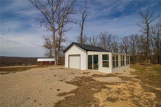 garage featuring driveway