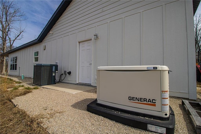 exterior space with cooling unit and board and batten siding