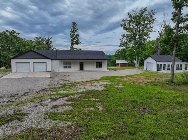 3813 Mt Horeb Rd, Camdenton, MO 65020 - ranch-style house with an attached garage, driveway, and an outbuilding