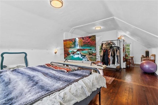 5801 E 56th St, Kansas City, MO 64129 - bedroom featuring lofted ceiling and wood-type flooring