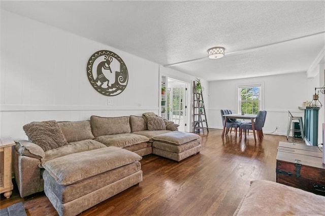 5801 E 56th St, Kansas City, MO 64129 - living room with wood finished floors and a textured ceiling