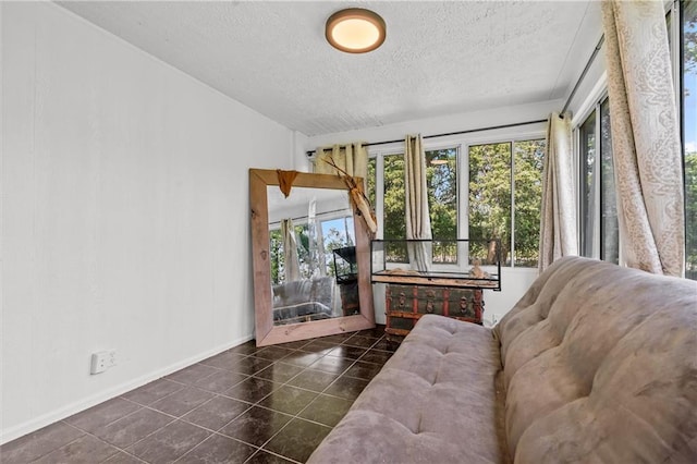 5801 E 56th St, Kansas City, MO 64129 - living area with a textured ceiling, tile patterned flooring, baseboards, and lofted ceiling