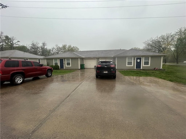 722 N Virginia St, Adrian, MO 64720 - ranch-style home featuring an attached garage, driveway, and a front yard