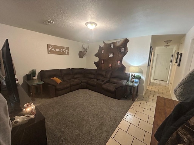 722 N Virginia St, Adrian, MO 64720 - living area featuring tile patterned flooring and a textured ceiling