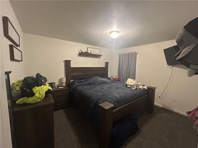 722 N Virginia St, Adrian, MO 64720 - carpeted bedroom with a textured ceiling and baseboards