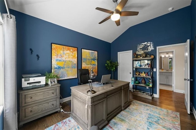 home office with ceiling fan, lofted ceiling, wood finished floors, and baseboards